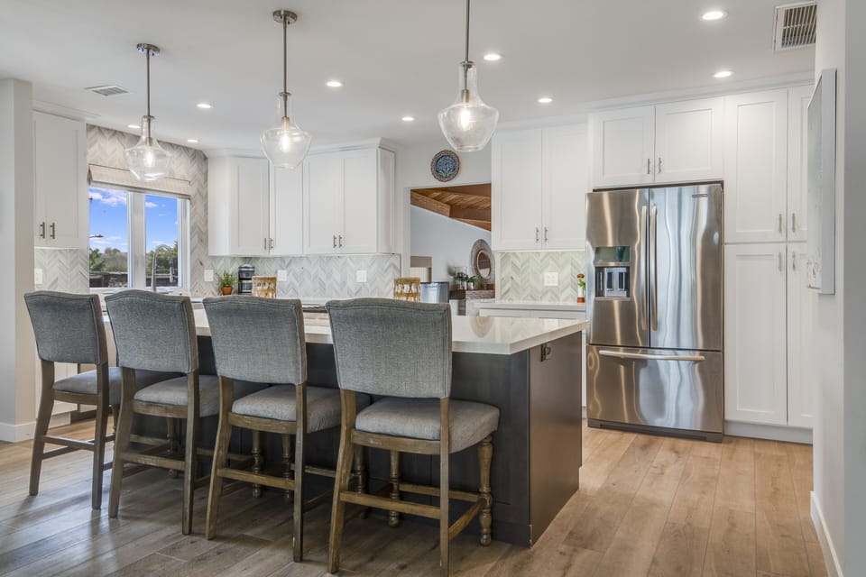Open concept kitchen and seating for 4 at the bar.
