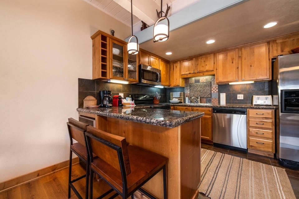 A warm, fully equipped kitchen with all the essentials for homemade meals and good times together.