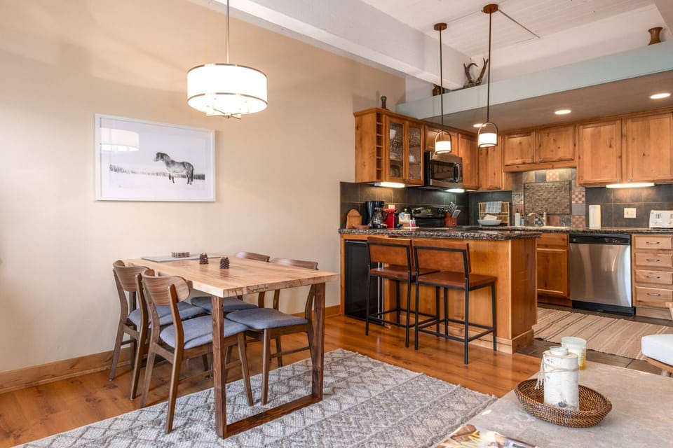 Great layout to seamlessly transition from cooking to eatings to entertaining from the dining area right off the fully-stocked kitchen.