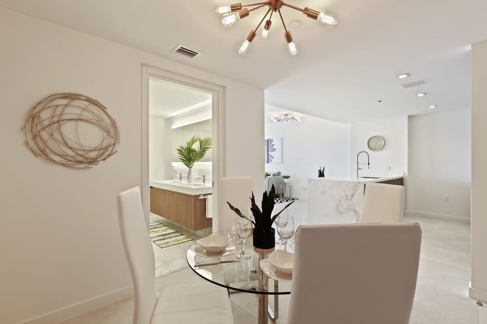 Comfortably sit four on the glass top dining table