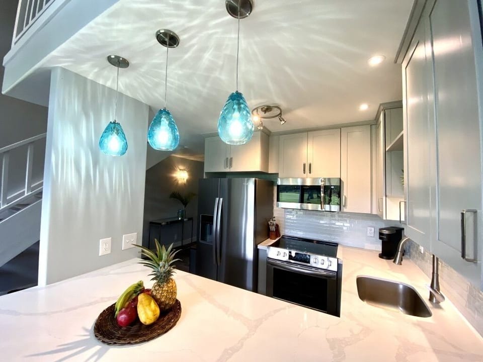 Well equipped kitchen with full size refrigerator, stove, microwave & dishwasher
