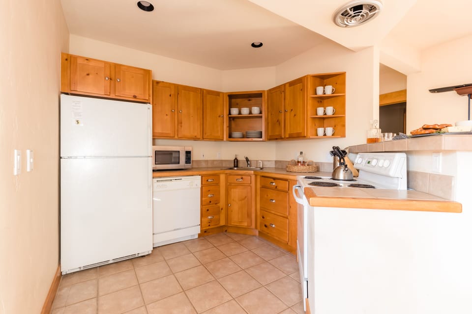 Downstairs pool room features an additional kitchen.