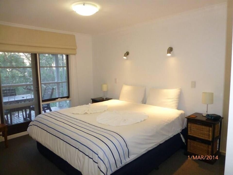 Relax in king bed luxury for a restful stay.