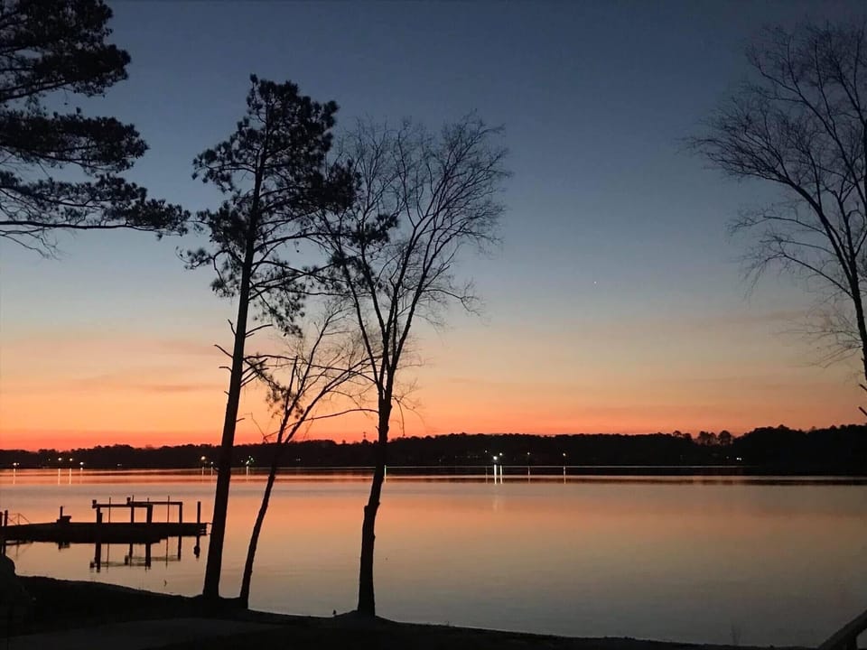 Enjoy a glass of wine with a colorful sunset 