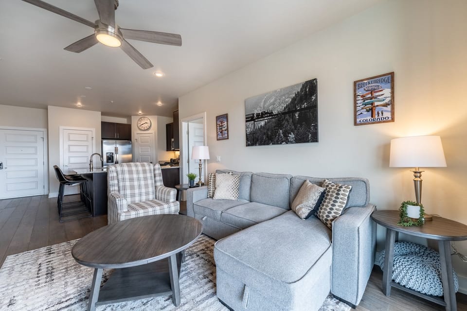 Sink into plush seating in this beautifully appointed living area, where mountain artwork and thoughtful decor create your perfect retreat.