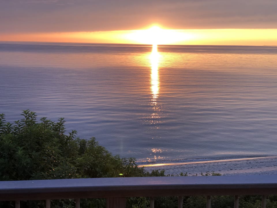 Sunset over a calm bay from the deck