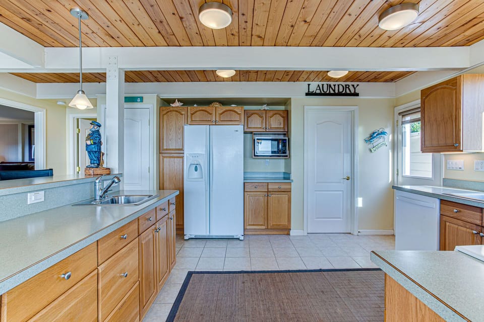 The laundry room is right off the kitchen.