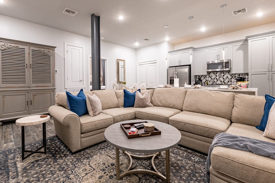 Open-concept living, kitchen, and dining area with ample seating for you and your guests. Enjoy a Samsung Smart 4K TV for streaming and DIRECTV Entertainment. The extra-large sectional also converts into a queen-size sleeper sofa!