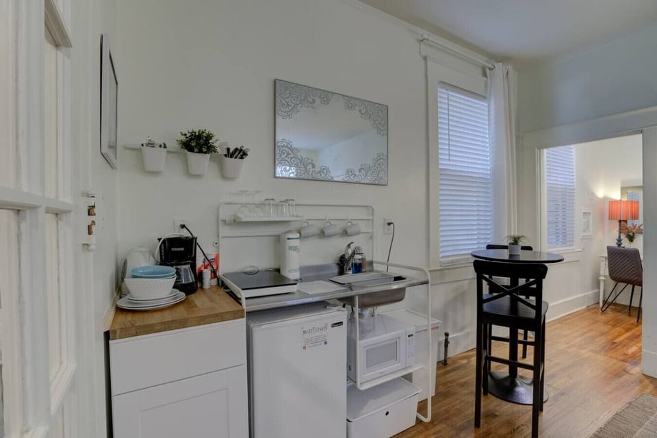 Cook up a meal in the kitchenette with an induction cooktop, microwave, mini-fridge with freezer, and basic essentials.