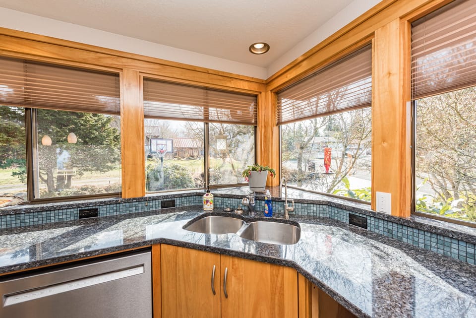 Enjoy the views of the garden from the kitchen and hummingbirds flying right up to the windows