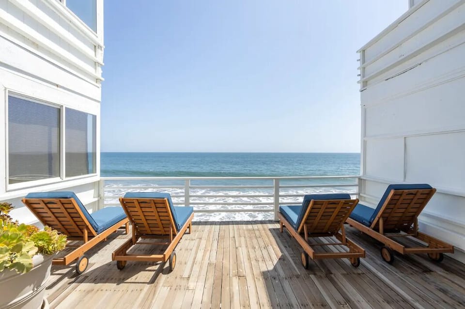 Common area deck with lounge chairs.