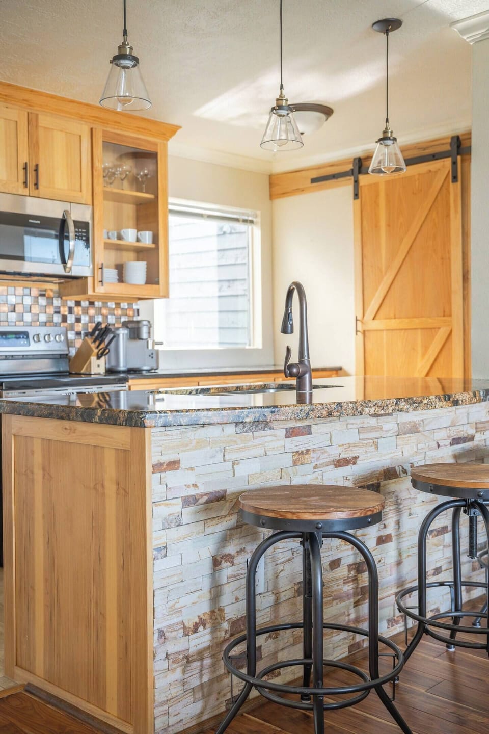 Cozy up at the island — perfect for coffee, cocktails, or keeping the chef company.