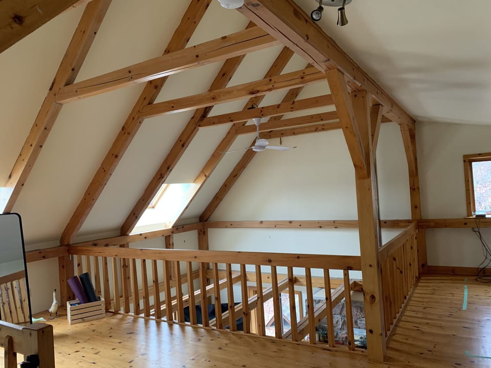 Soaring living room ceiling flows to second level with 3 skylights