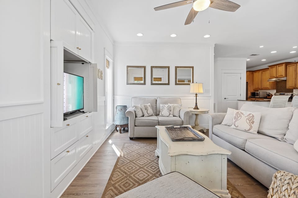 Bright and cozy living space featuring coastal décor, plush seating, and natural light—perfect for relaxing after a sun-soaked day on 30A.