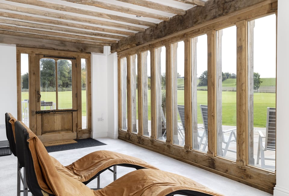 Ground floor: Relax in the sun room looking out towards the grounds