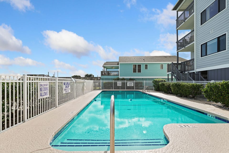 Cool off in this sparkling pool surrounded by coastal charm and endless blue skies.