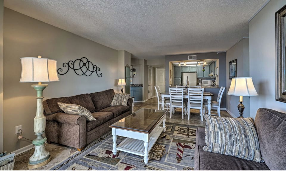 Spacious, open concept living room, dining table and kitchen