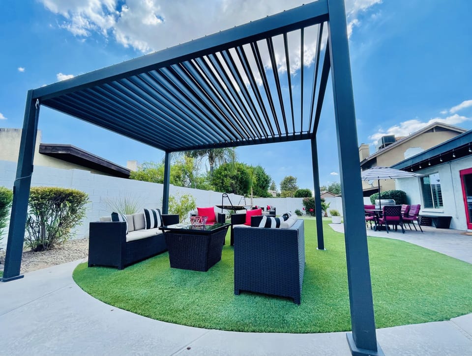 Outdoor dining table and BBQ area perfect for gathering after a day Scottsdale