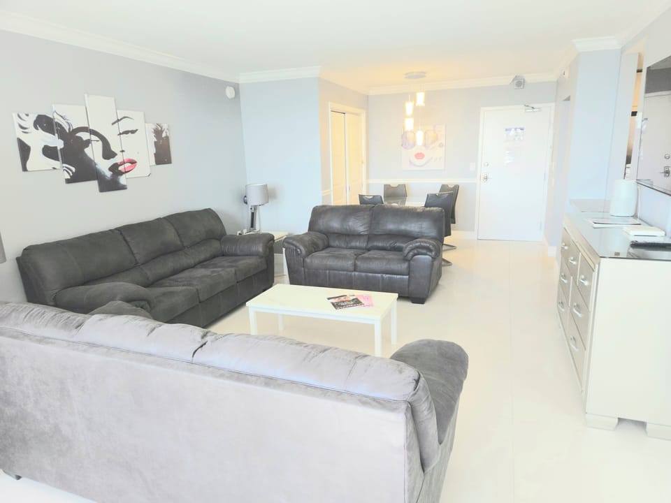Large living room with plenty of space for everyone.  Sofa bed