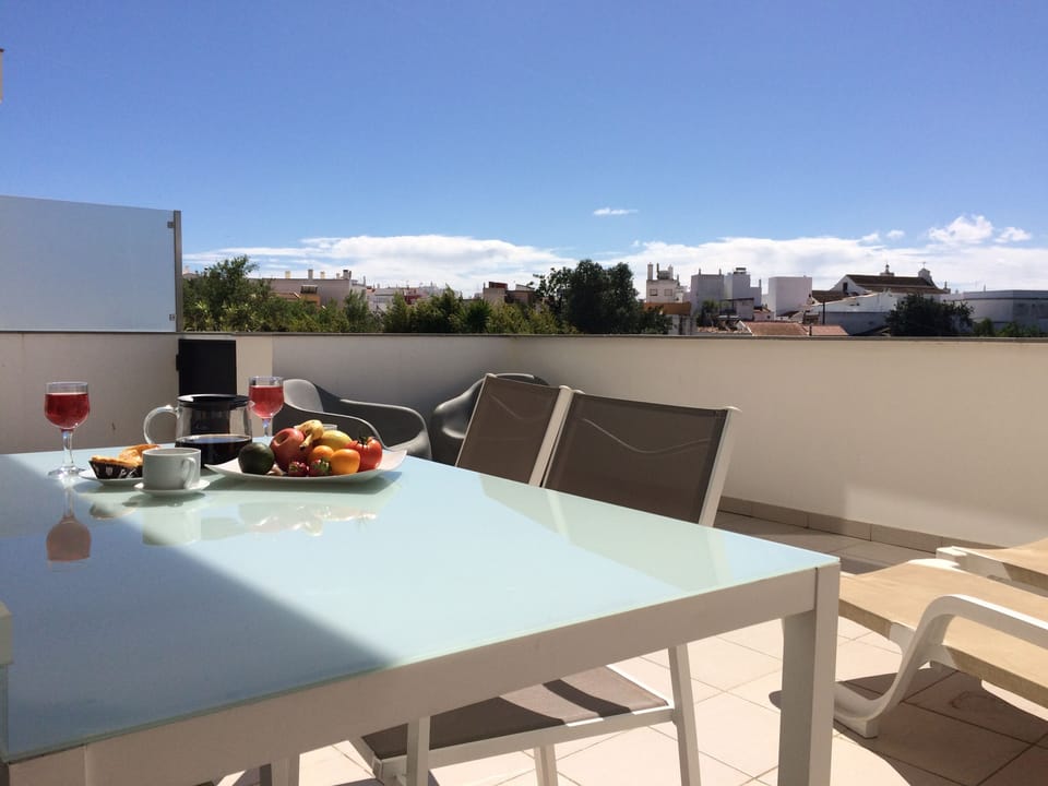 Spacious main private terrace with dining, seating and sun loungers