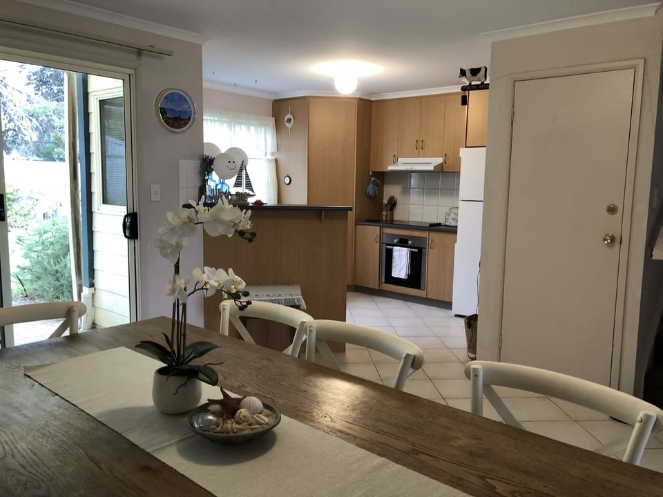 Dining, Kitchen area, sliding door to pergola area & back yard