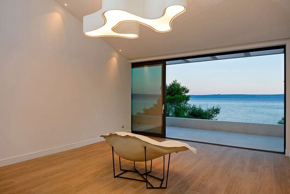 Comfortable room with large sliding doors and view of the sea in Croatian luxury villa Silvery Moon on Brac with sea view