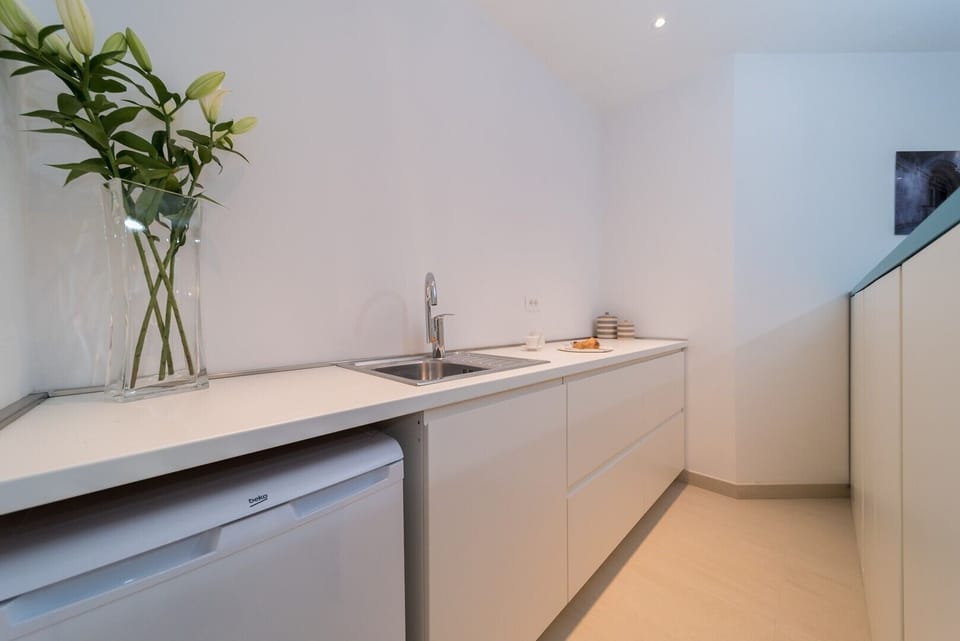Kitchenette in the bedroom of the beachfront villa with private heated pool for vacation with friends