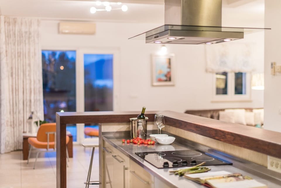 Electric stove in a modern kitchen of a Croatia luxury villa Mediterranean with heated pool and parking 
