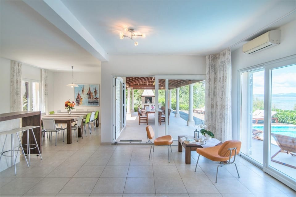 Living room with comfortable seating area in a Croatia luxury seafront villa for family vacation on Brac island
