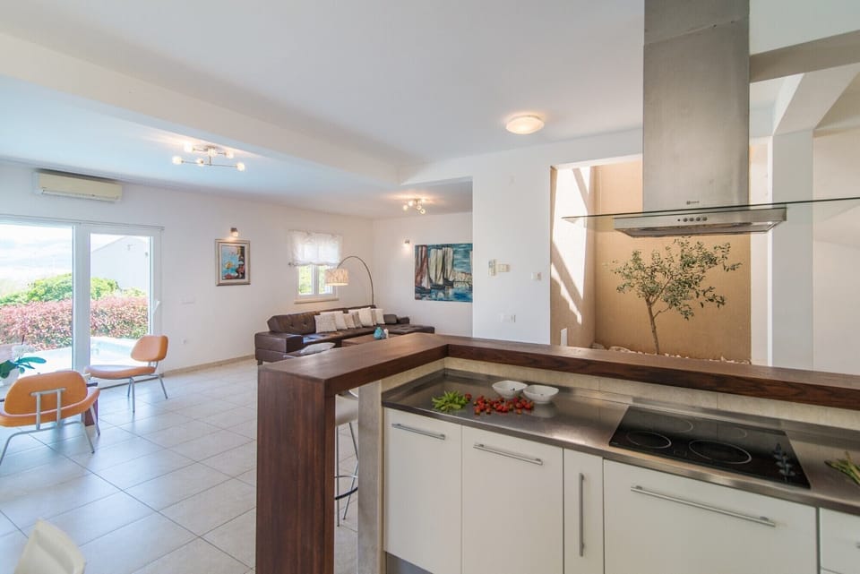 Electric stove in a modern kitchen of a Croatia luxury villa Mediterranean with heated pool and parking
