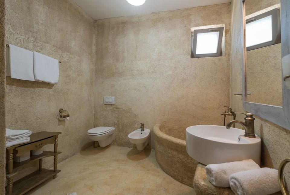 En suite bathroom with shower in Brač luxury beachfront villa Oasis with pool and parking.