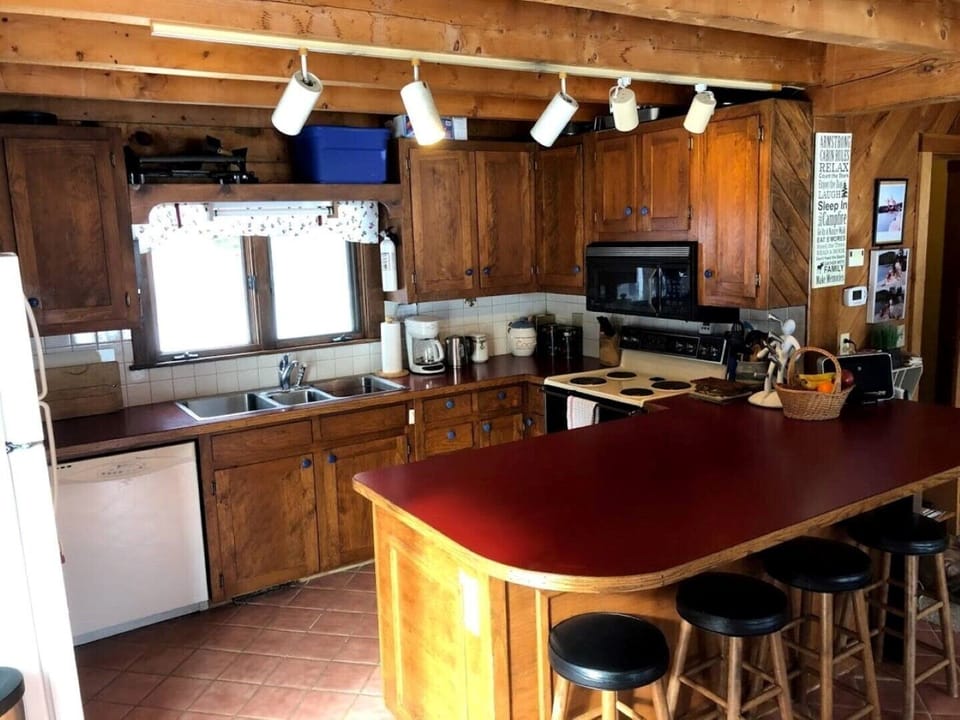 Large well-equipped kitchen with huge eat-in peninsula.