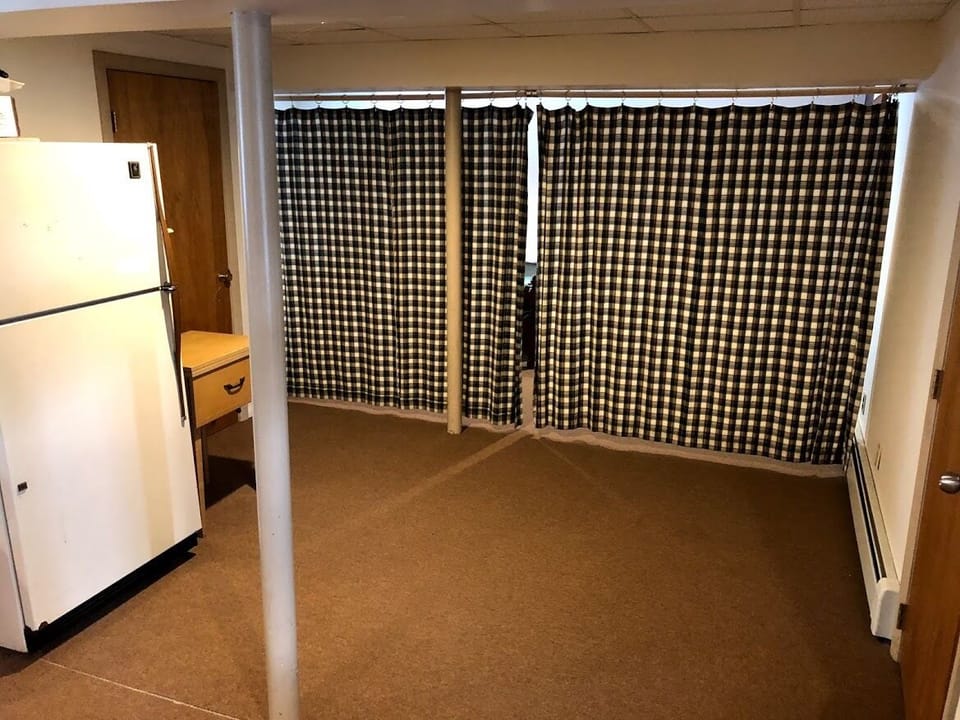 Basement area with the privacy curtain drawn.