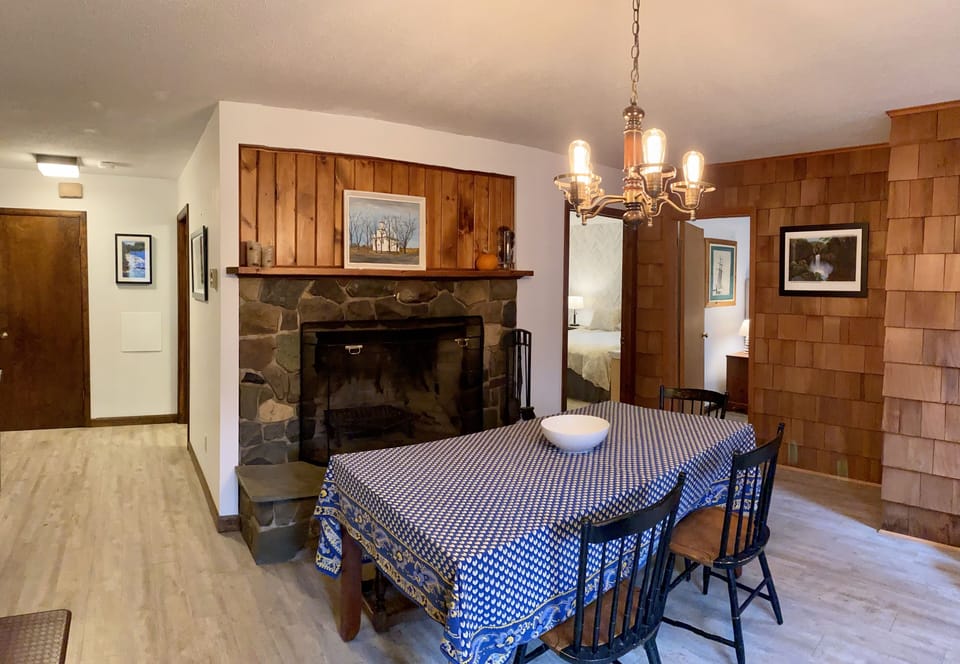 Massive eat in kitchen features 2nd wood burning fireplace and dining for 6