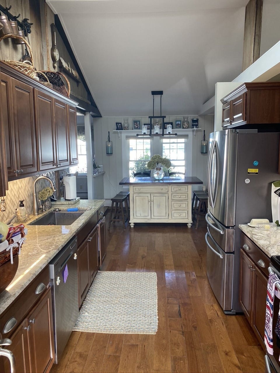 Updated Kitchen - granite countertops, stainless steel appliances & seating area