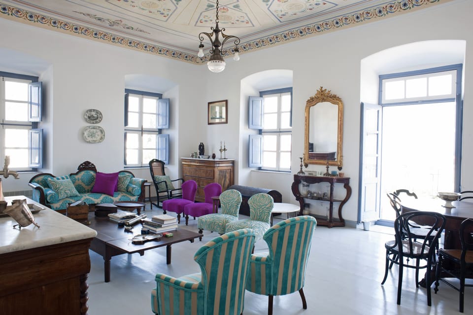 Upstairs Living room with hand painted ceiling on canvas, balcony & sea view