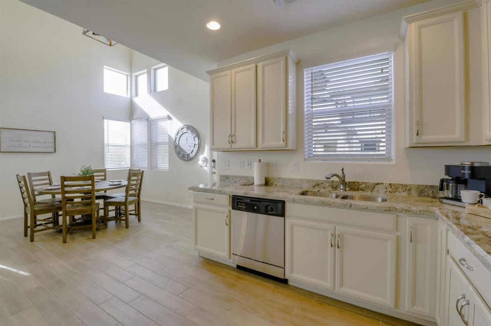 Fully equipped kitchen with stainless steel appliances and granite countertops