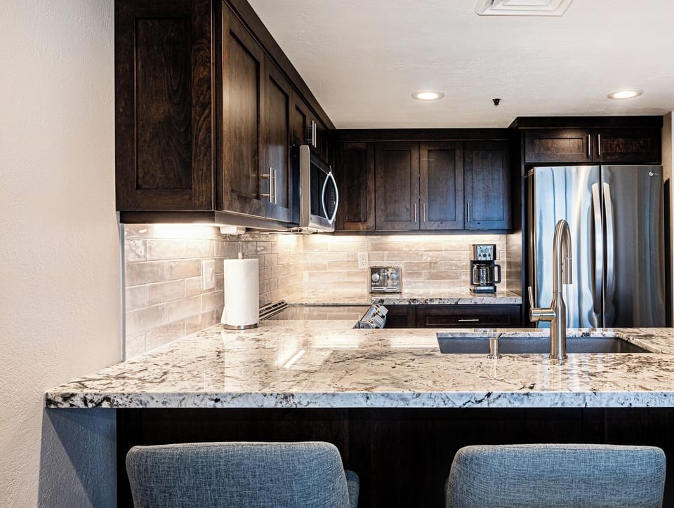 Fully equipped kitchen with stainless full sized appliances