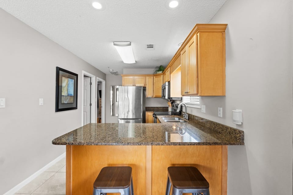 Have a seat at the breakfast bar for a cup of morning coffee or just have a chat with the cook.
