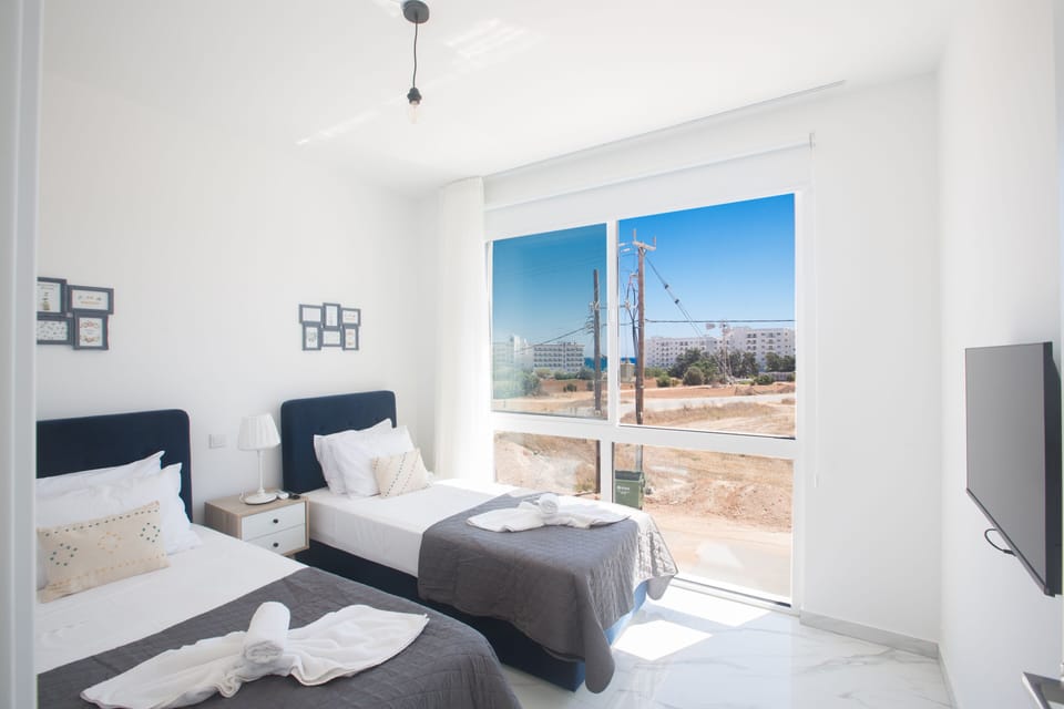 Bedroom 4 with two single beds and widescreen TV
