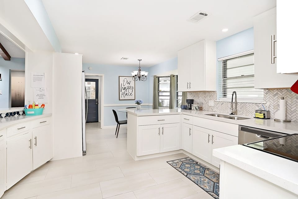 Enjoy cooking in this beautiful, fully equipped kitchen with full-size fridge. 
