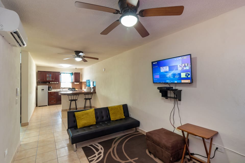 Smart TV, Dishnet satellite, A/C, overhead fans, sofa bed in living room