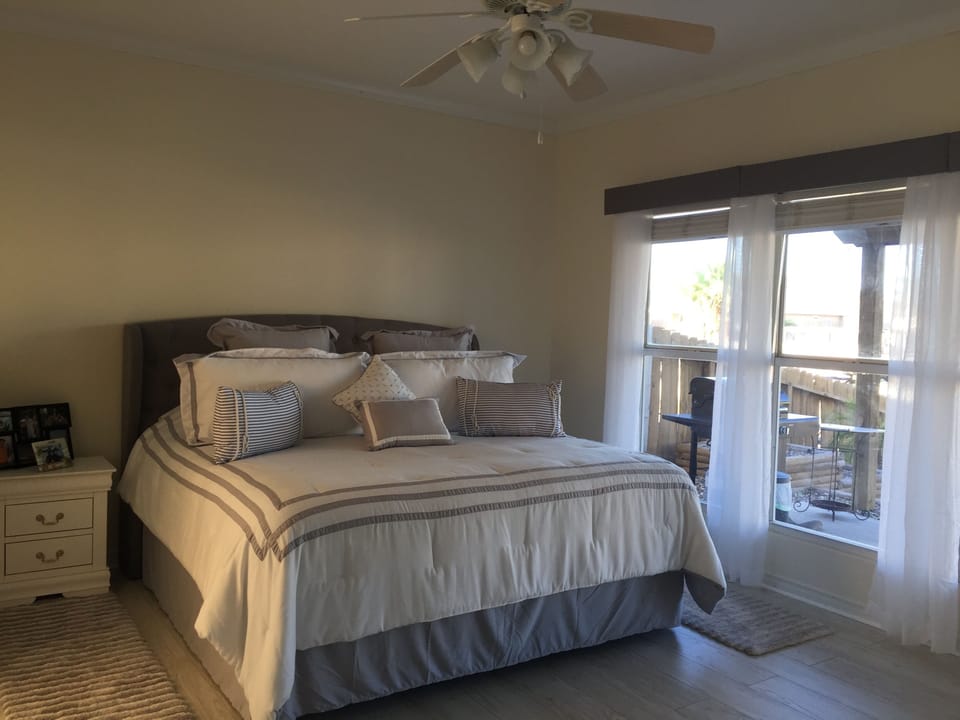 king bed and tv in master bedroom
