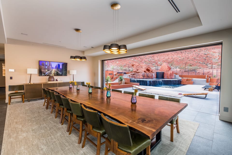 Dining room leading to back patio with pool view