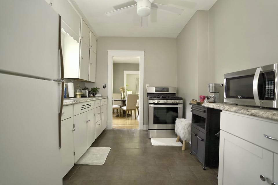 Kitchen - new stove, microwave and keurig.  Stocked with coffee grinds & kcups