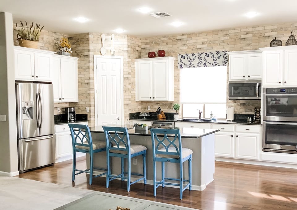 Spacious, immaculate kitchen with double ovens.