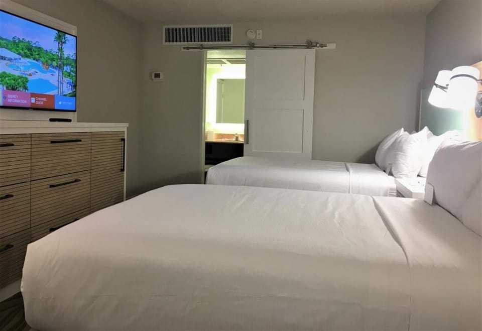 Kick back with in-room TV and two comfy beds.