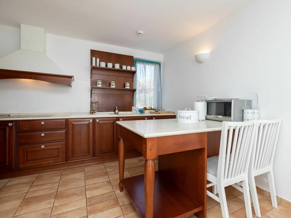 Furniture, Room, Property, Cabinetry, Kitchen, Building, Table, Floor, Interior Design, Countertop