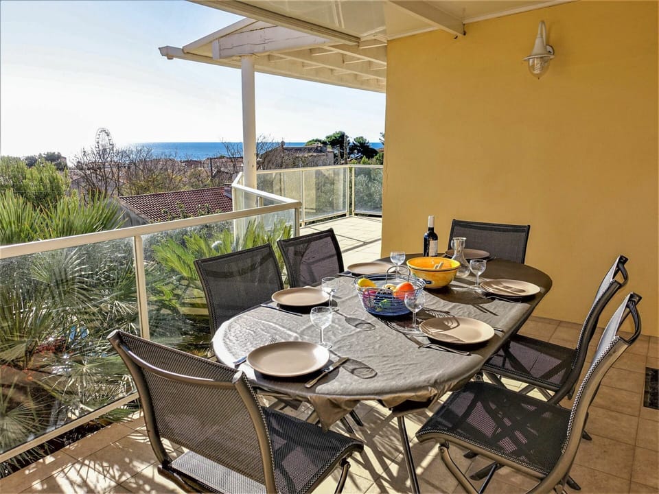 Plant, Table, Furniture, Property, Chair, Flowerpot, Building, Sky, Outdoor Table, Houseplant