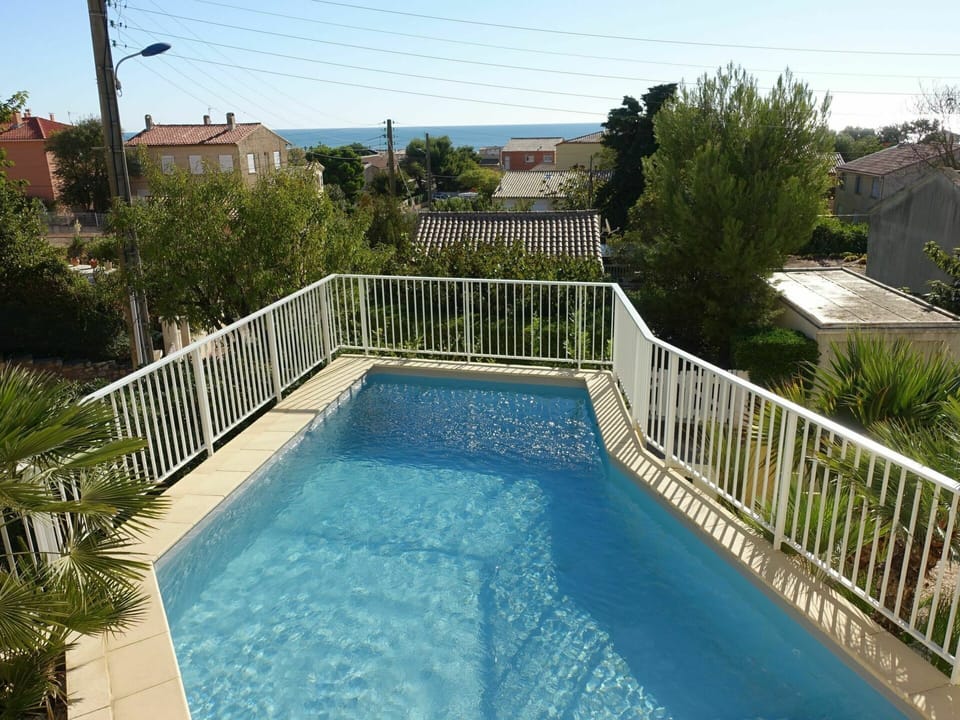 Water, Plant, Property, Swimming Pool, Sky, Tree, Rectangle, Building, Chair, House